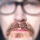 close up image of Tim's moustachioed mouth